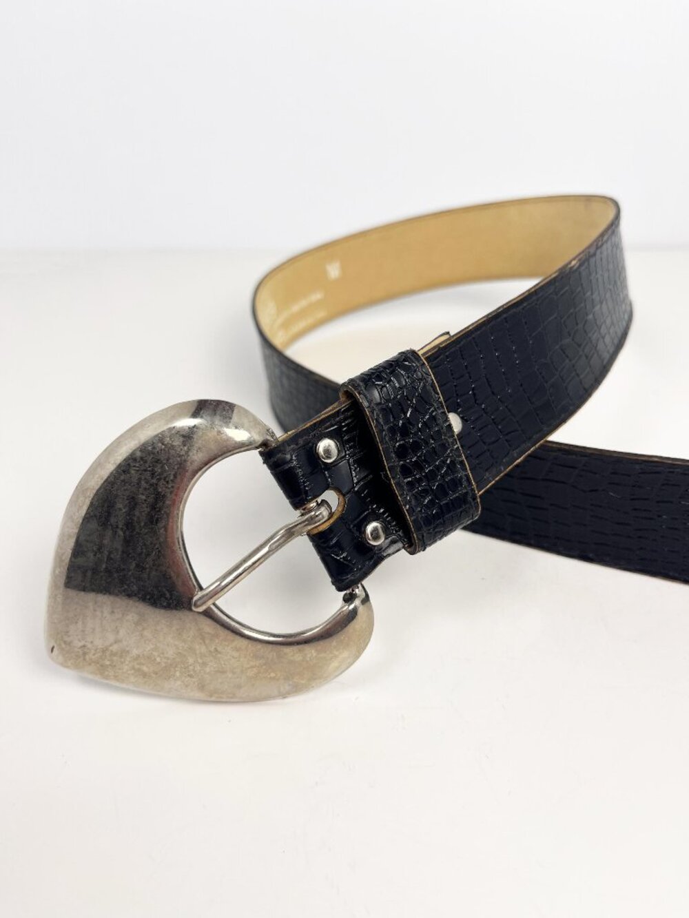 Vintage black faux snakeskin belt with large heart-style buckle